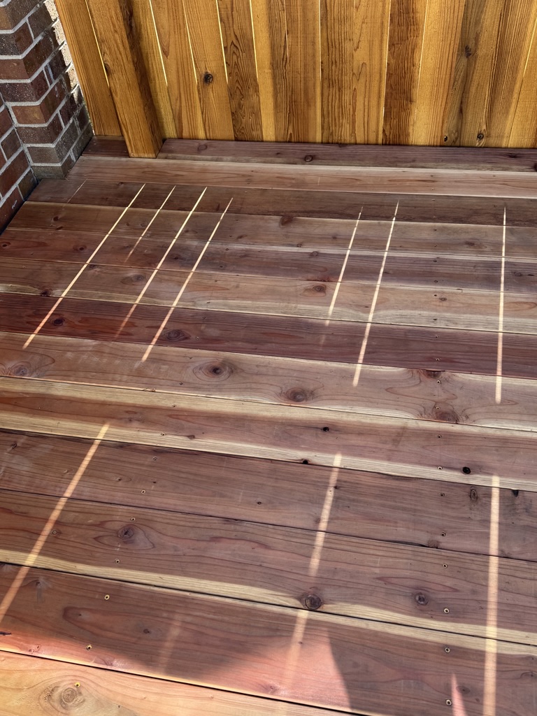 Redwood Deck Floor freshly installed by Valenzuela Fence . which showcases a durable and elegant Redwood Deck in all residential properties all around Denver county, Arapahoe county, Douglas county and Surrounding areas.