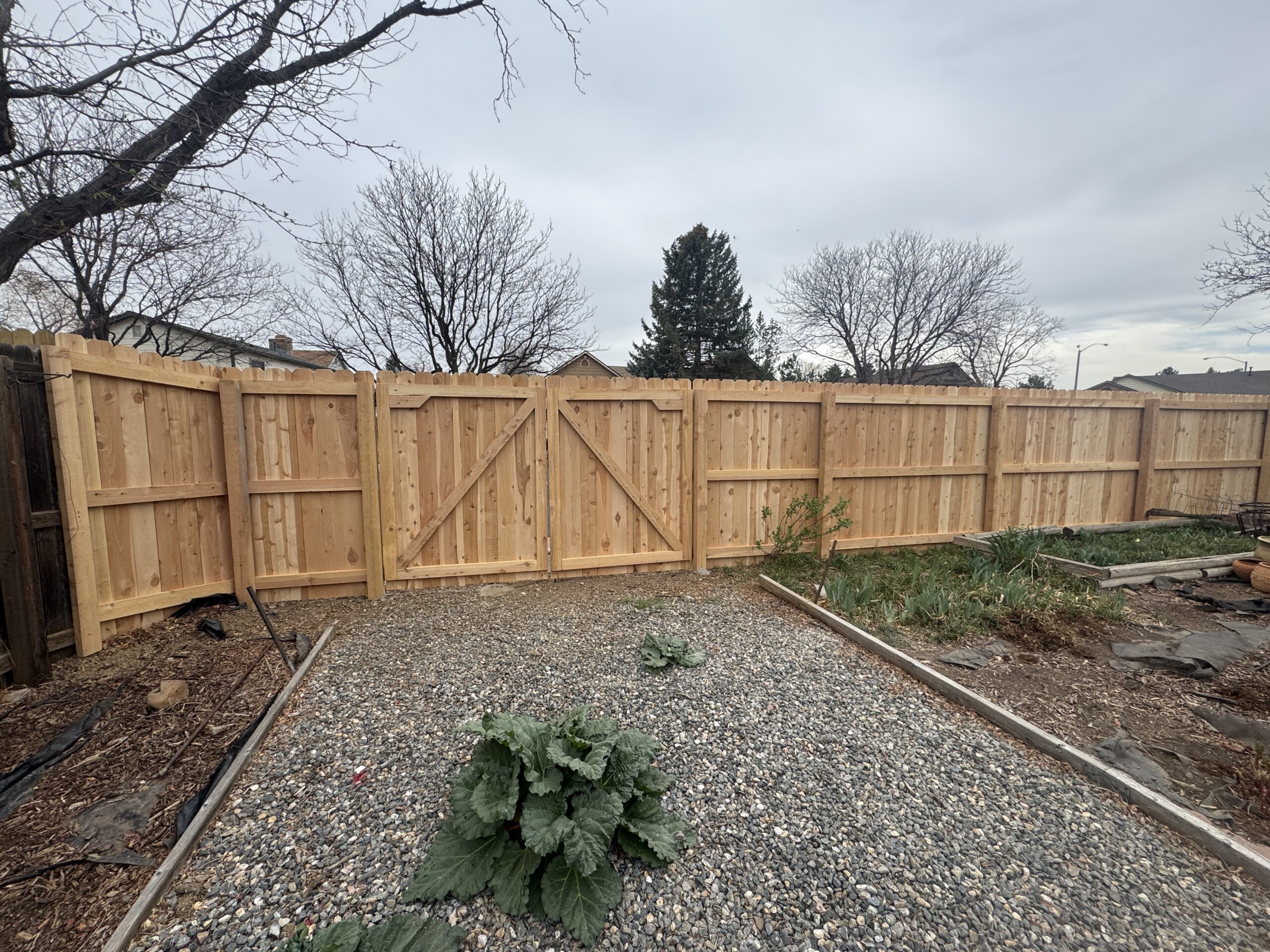 Back Side Dog Ear Cedar Privacy Fence with double gate.
